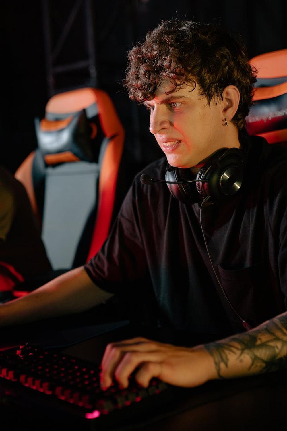 curly_haired_man_playing_computer_game