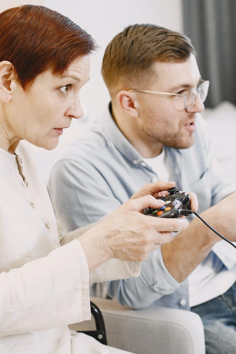 woman_in_white_jacket_and_man_in_glasses_holding_j